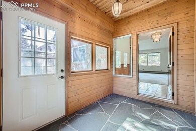 Front entry with slate floors, with a notable chan
