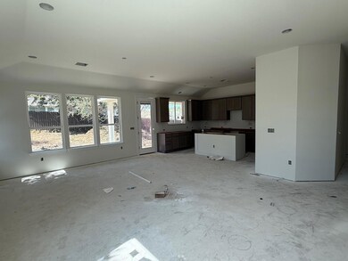 Unfurnished living room with vaulted ceiling