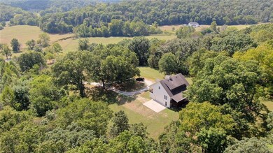 The home overlooks a beautiful setting with the valley below and the Coler mountain bike preserve just beyond the valley.