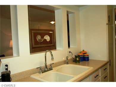 Kitchen - Kitchen sink with opening to living room