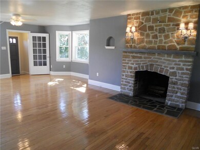 A stunning stone fireplace and charming features