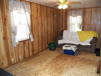 Living Room. Great size! Not a fan of the paneling