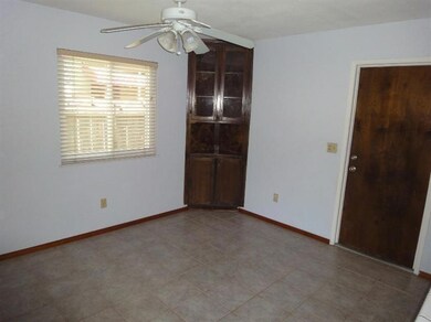 Dining room with a corner cabinet.