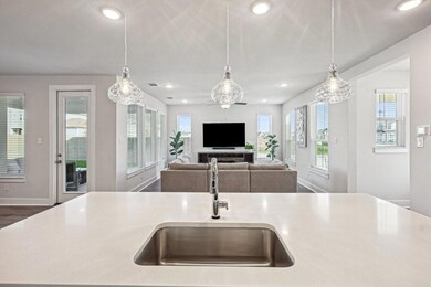 Kitchen featuring pendant lighting, a center islan