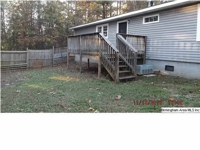 Deck and fenced back yard