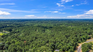 Aerial view of a heavily wooded area