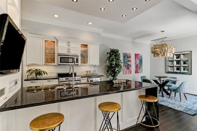 Peninsula island kitchen features a built in flat