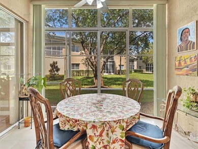 Enclosed glass patio, perfect for relaxing and enjoying the garden view.