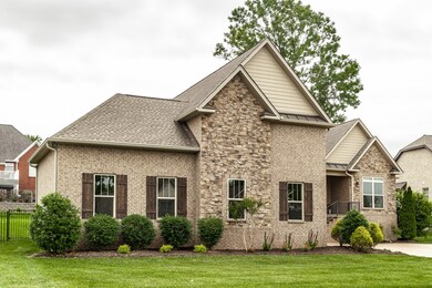 Traditional brick and stone home with hints of french country.