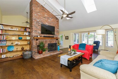 Stunning floor to ceiling fireplace and new hardwood floors!