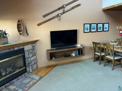 Living room featuring a fireplace and light hardwo