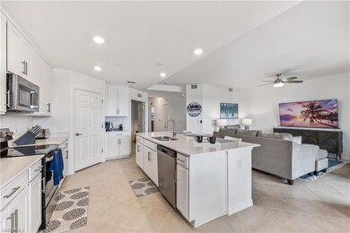 Kitchen featuring ceiling fan, light tile floors, 