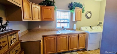 Enormous Laundry room w/ sink & cabs