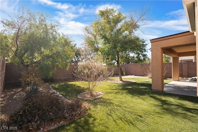 Fenced backyard featuring a patio