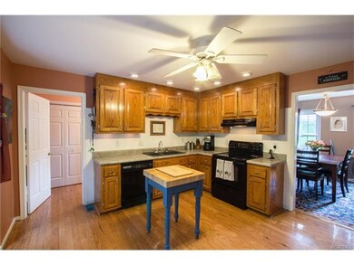 Spacious kitchen with hardwood floors.