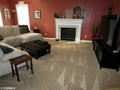 Den/Family/Great Room - Family Room features a Semi Vaulted Ceiling with Skylights, Ceiling Fan and Gas Log Fireplace with Marble Surround.  *** Bonus...Seller just installed all new Carpet throughout First and Second Floor!