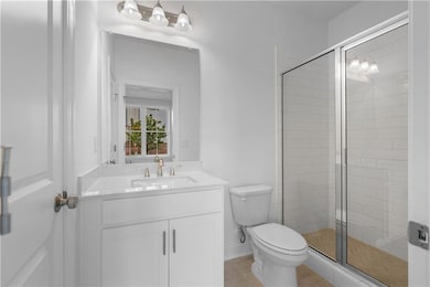 Full bathroom with walk in shower on terrace level - lots of tile and very light and bright