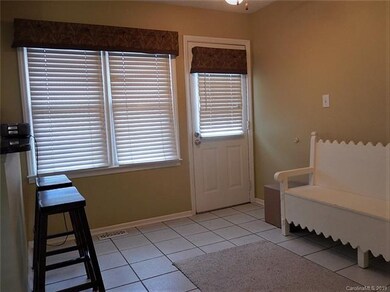 Breakfast area with a door leading to the back deck.