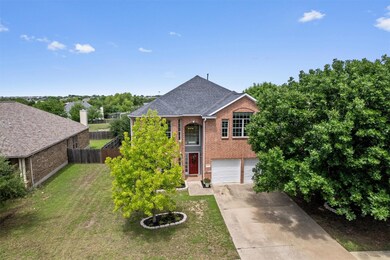 Traditional-style home with brick siding, concret