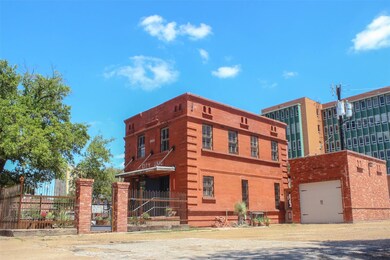 Beautiful Red Brick Building Renovated. Includes one car garage with rooftop deck