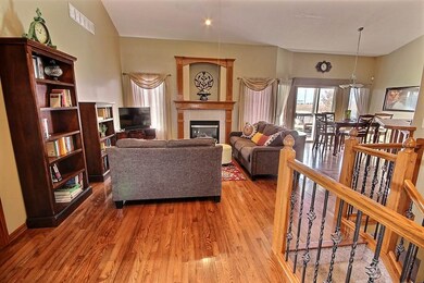 Tiled entry leads into updated hardwood floors in 