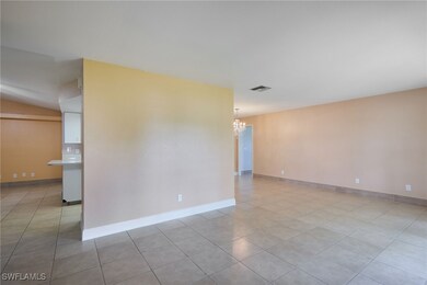 Front entry living room featuring light tile patte