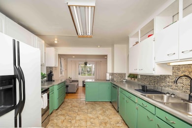 Kitchen view from back entrance of home