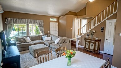 View from formal dining to living room. Far right is guest bathroom.
