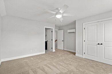 Unfurnished bedroom featuring a closet, ceiling fa