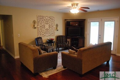 The living room is open to the kitchen and dining 
