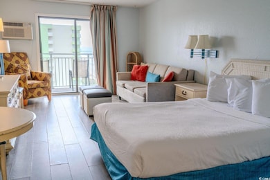 Bedroom with hardwood / wood-style floors, access 