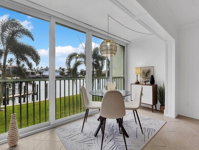 Sunroom featuring a water view