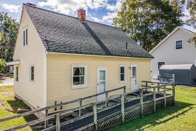 view of back of home with ramp