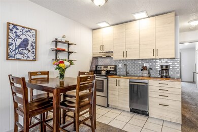 Kitchen featuring sink, wooden counters, light til