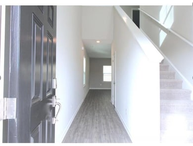 Foyer entrance with light wood-style flooring, rec