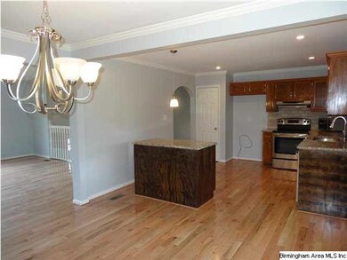 Another view of formal dining room and kitchen