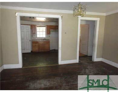 Exterior Front. View of Living Room into the Kitch