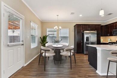 Kitchen featuring stainless steel refrigerator wi