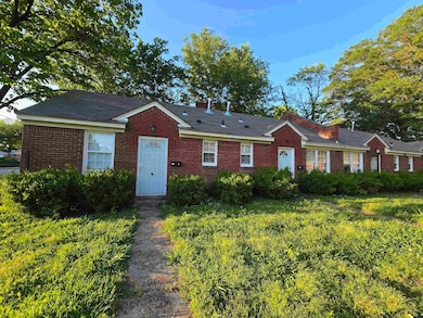 View of front of home featuring brick siding