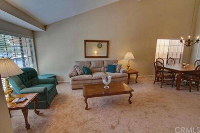 Living/dining room has vaulted ceiling.