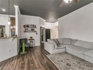 Living Room:  Trendy wood look tile extends throug