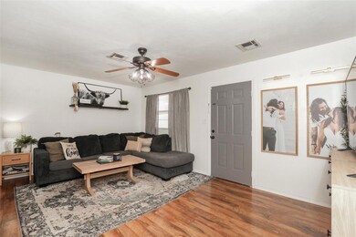 Living room with dark hardwood / wood-style floors