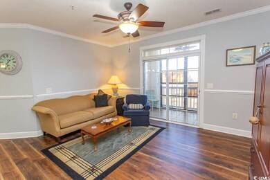 Living room with dark wood-style floors, ornamenta