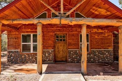 Property entrance featuring stone siding