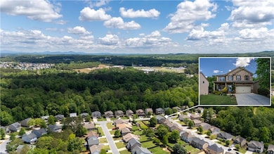 Birds eye view of property with a forest view and 