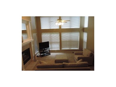 Family room with  vaulted ceilings, newer carpet, 