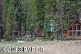 View of neighbor behind cabin