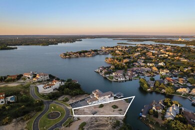 Aerial view at dusk of a water view, property bou