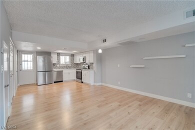 View of Living Room, Dining Room, kitchen and back