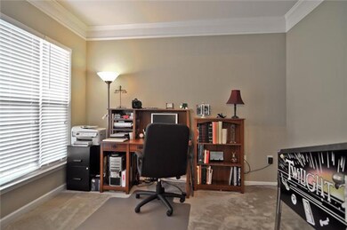 Double doors with glass panes lead to the front office